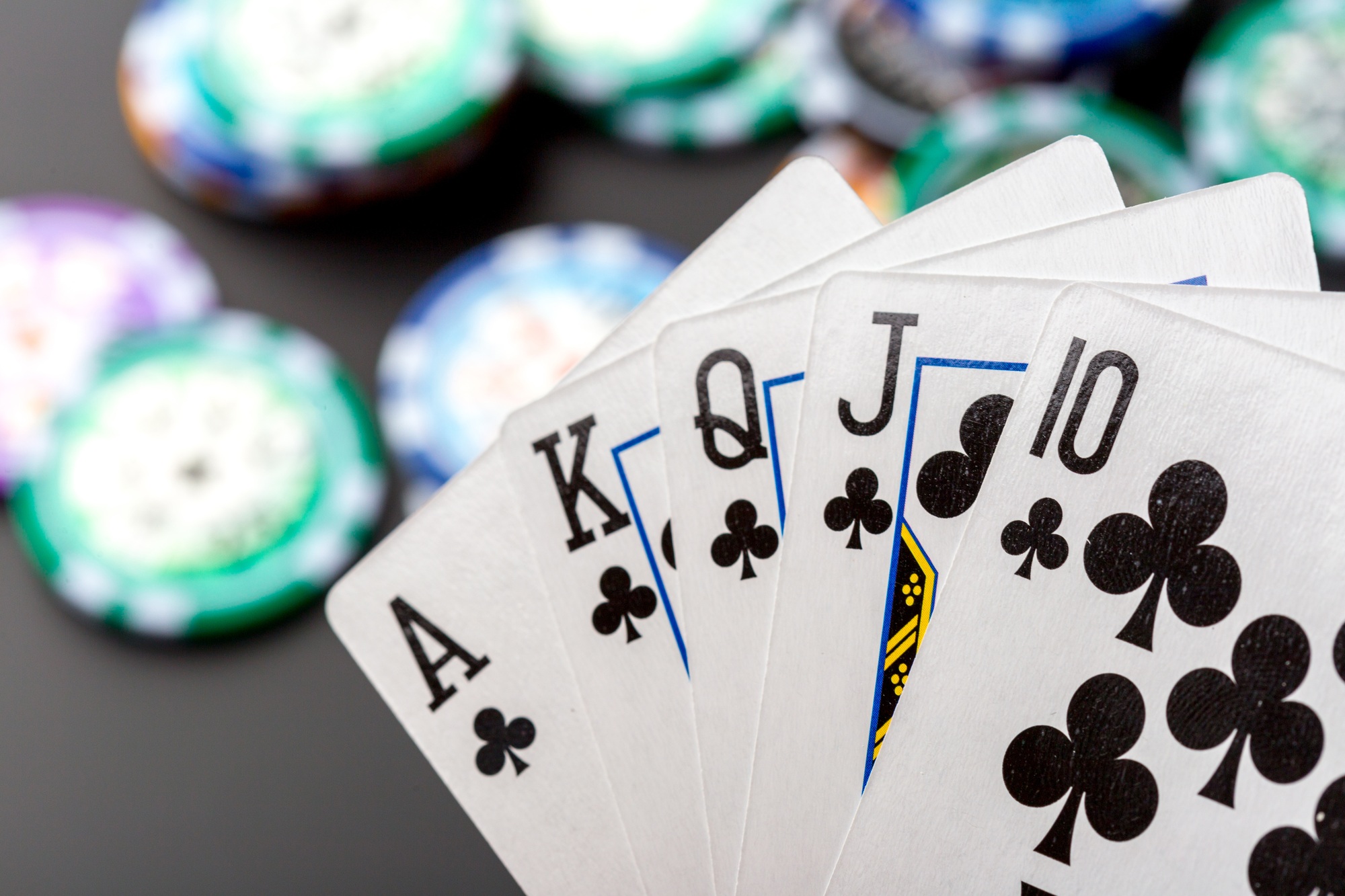 poker chips and cards on black background